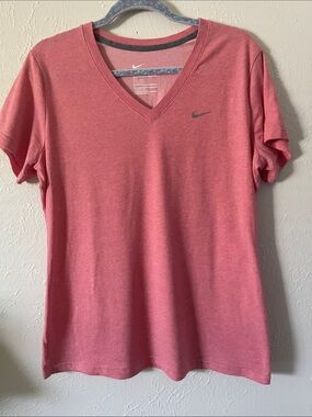 Nike Women's V-Neck T-Shirt. Color is mixture of pink/peach